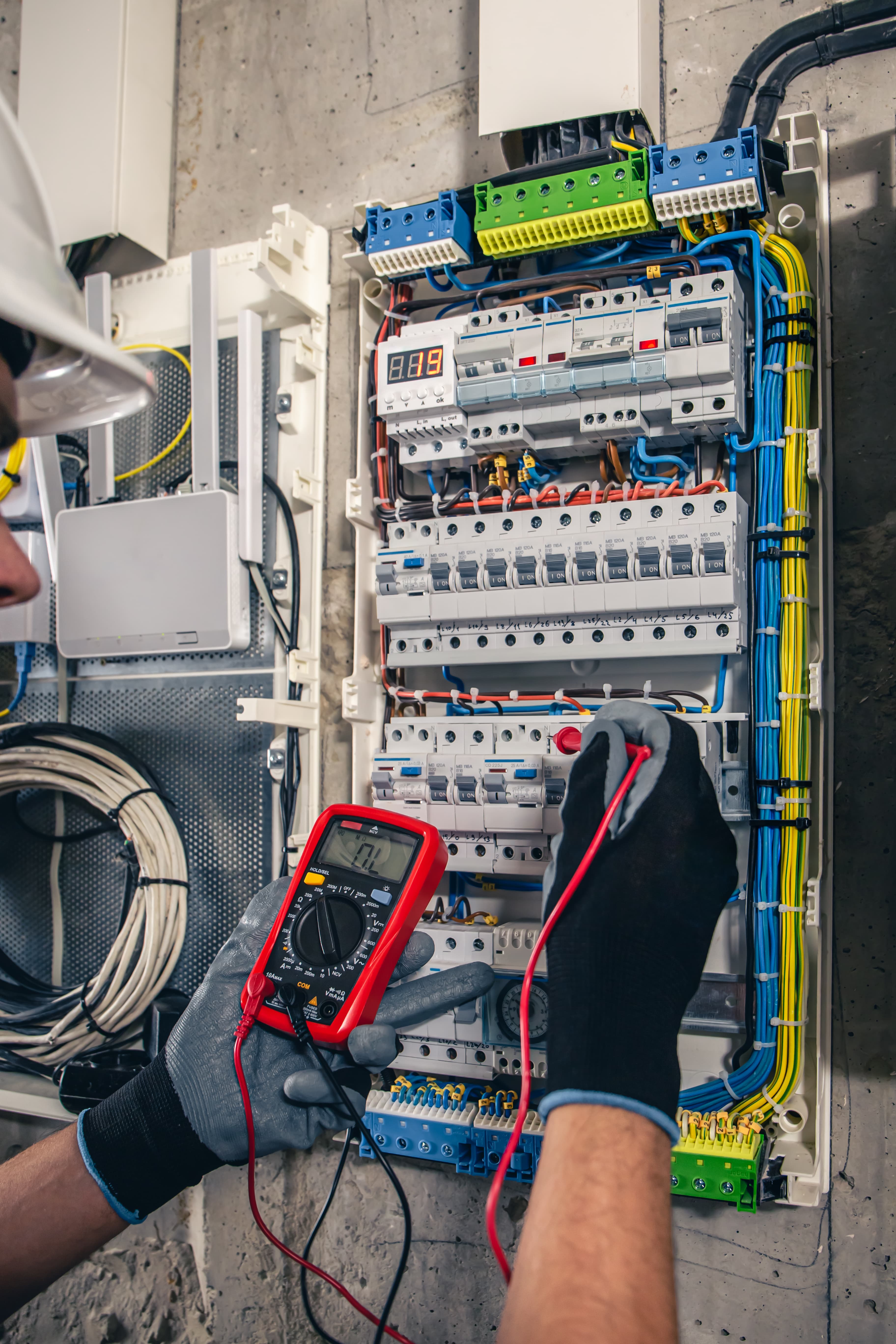Electrical specialist working on industrial fuses
